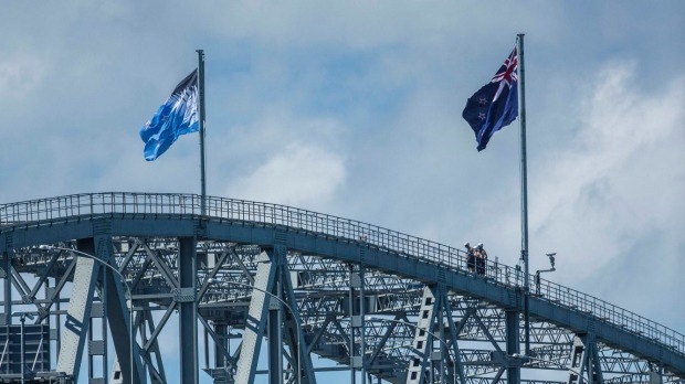 NZ flag options side by side on Auckland Harbour Bridge